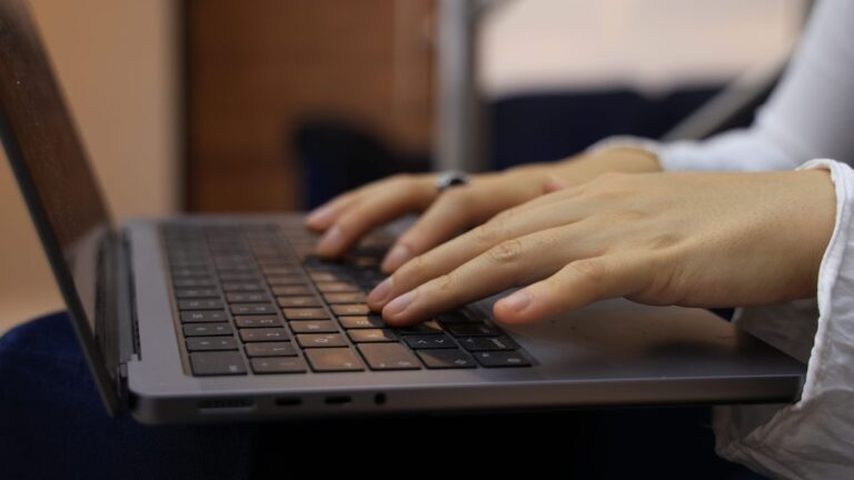 Person using data recovery software on a laptop