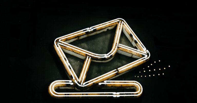 A glowing neon envelope symbol representing email