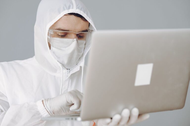 Person using a laptop with antivirus protection