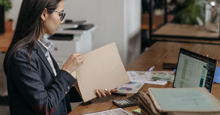 Person reviewing documents to choose account security software